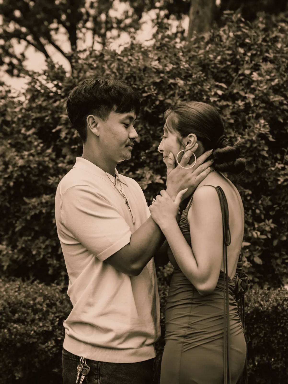 A quiet toned moment between the couple in the garden