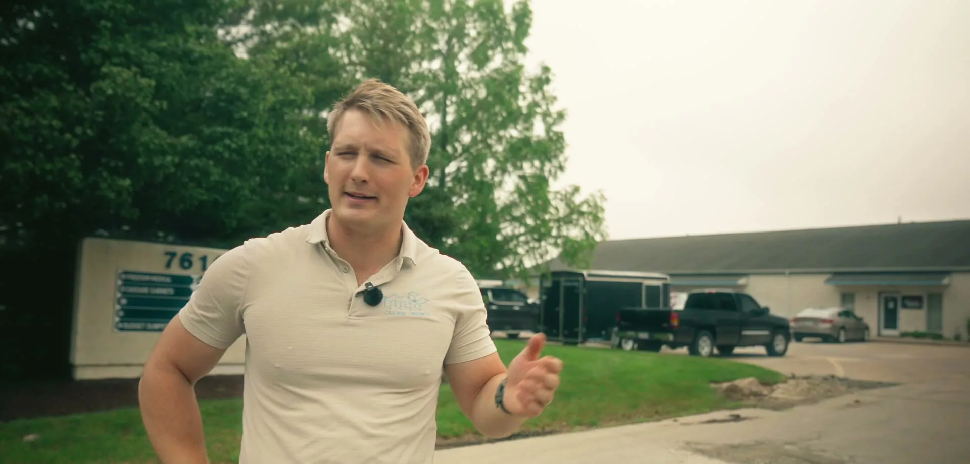 The owner of Cascade Cabinets speaking on camera outside his shop